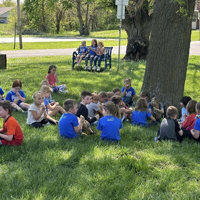 The 1st Grade Blue Crew taking a break from their volunteer work at Crestview Park.