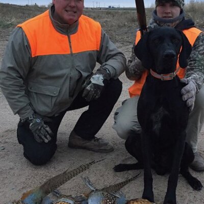 A Youth Pheasant Hunter with his successful hunt!!