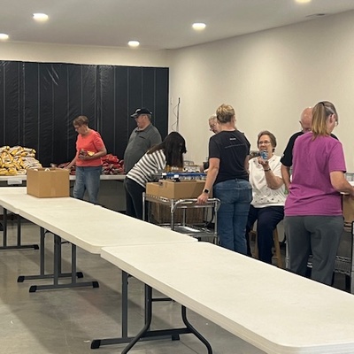 Bagging commodities in fellowship hall.